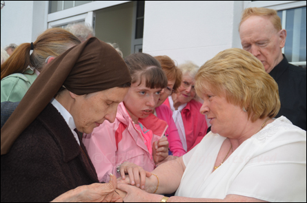 Christina Gallagher and Fr McGinnity outside the House of Prayer Achill 2016